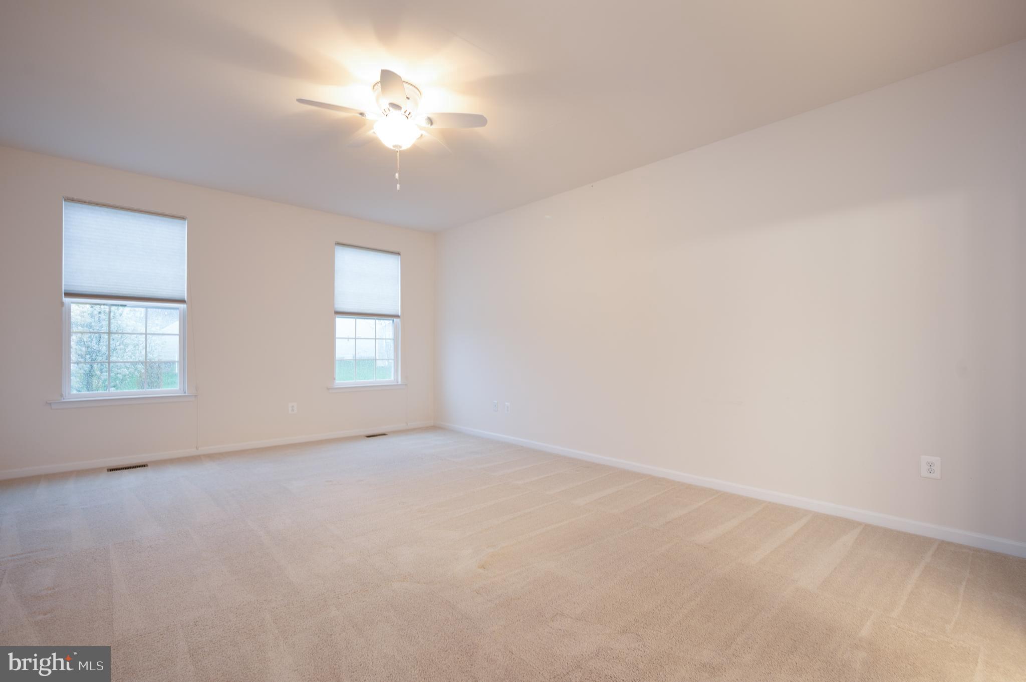 173 Silver Maple Road Middletown, DE 19709 - Photo 17 of 36 wooden floor in an empty room with a window