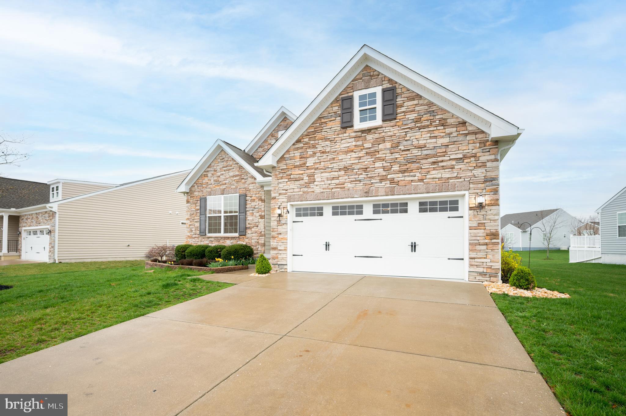 173 Silver Maple Road Middletown, DE 19709 - Photo 31 of 36 a front view of a house with a yard and garage