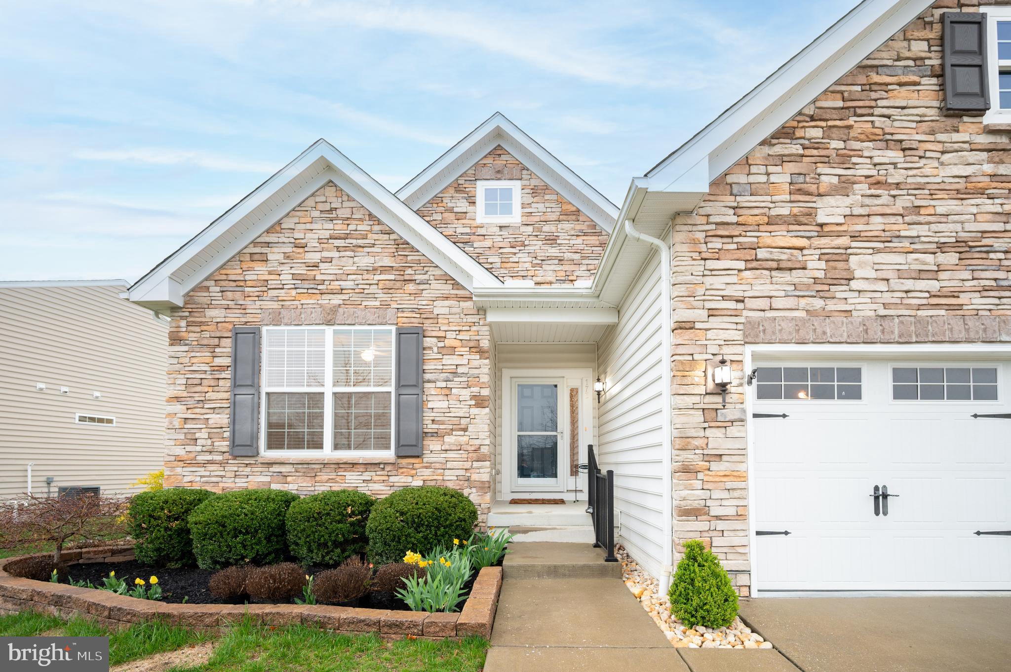 173 Silver Maple Road Middletown, DE 19709 - Photo 33 of 36 a view of a brick house with potted plants
