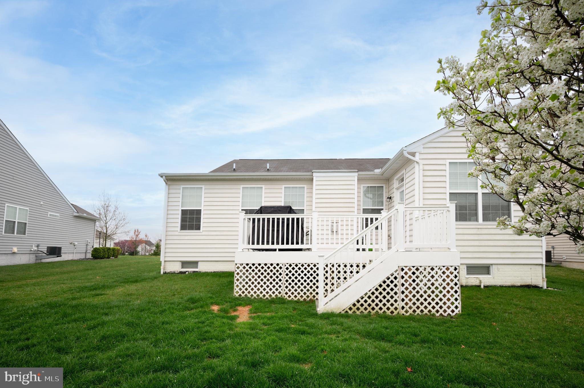 173 Silver Maple Road Middletown, DE 19709 - Photo 34 of 36 a front view of a house with a garden