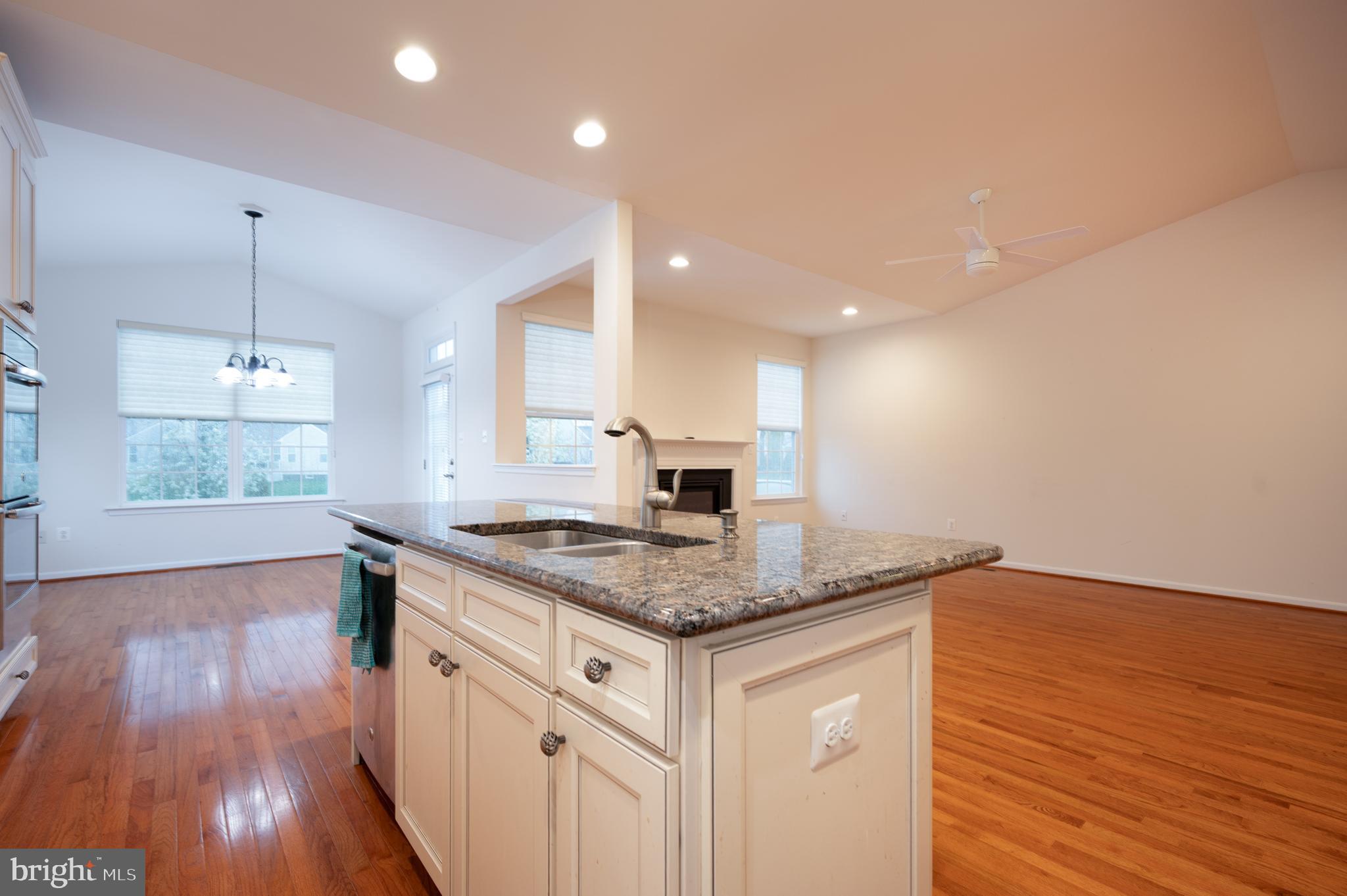 173 Silver Maple Road Middletown, DE 19709 - Photo 6 of 36 a kitchen with a sink and wooden floor