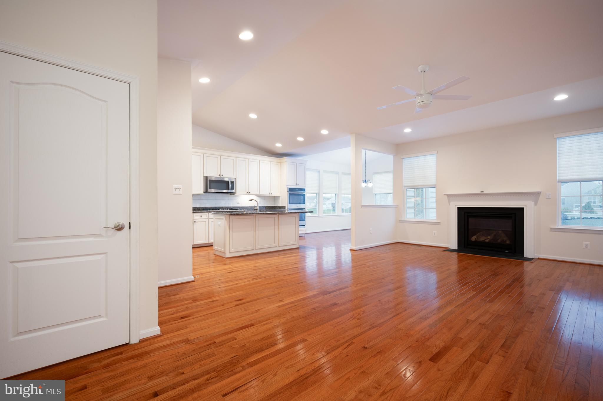 173 Silver Maple Road Middletown, DE 19709 - Photo 8 of 36 a view of kitchen with wooden floor and a window