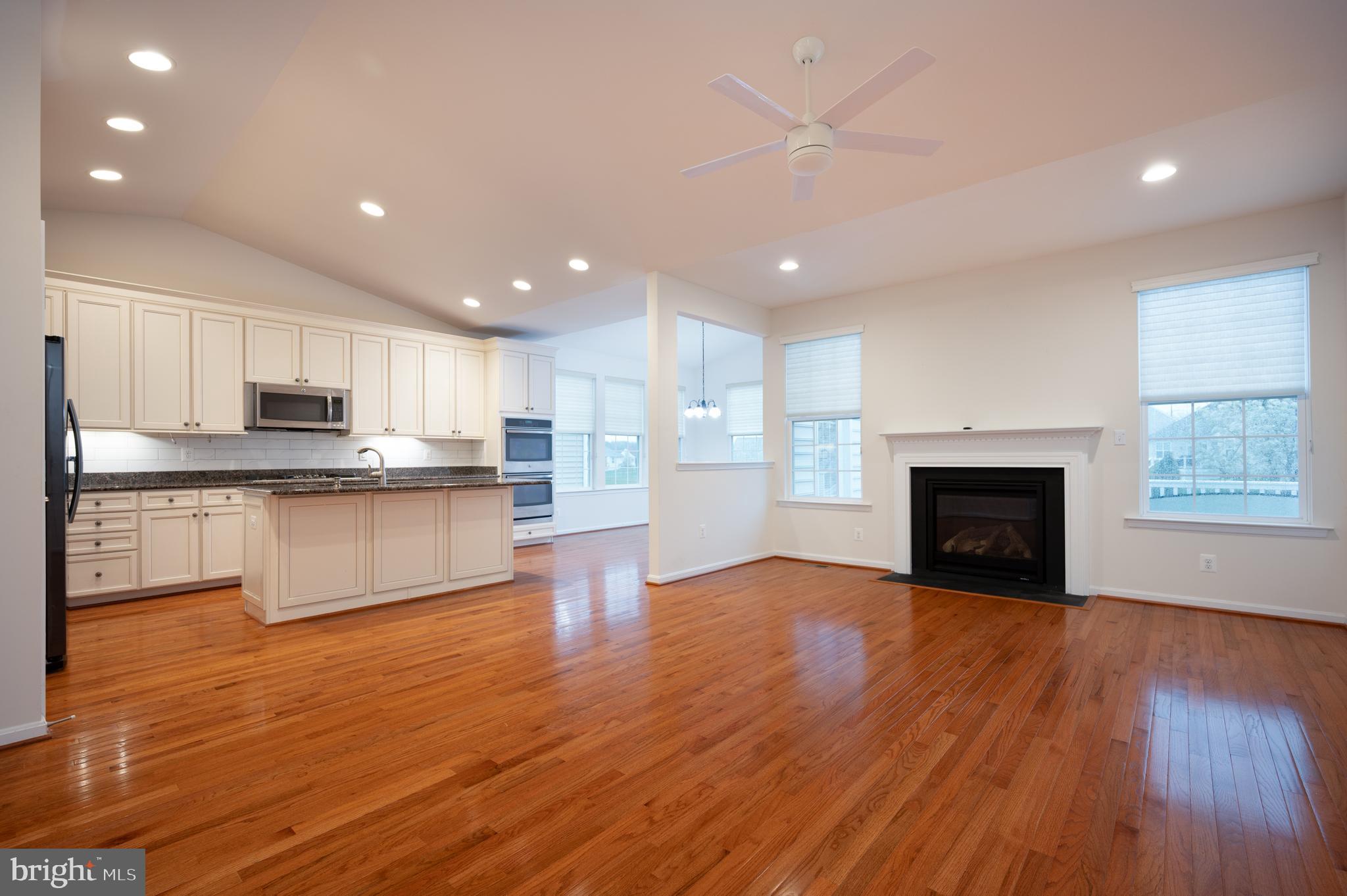 173 Silver Maple Road Middletown, DE 19709 - Photo 9 of 36 a view of kitchen with kitchen island wooden floor and center island