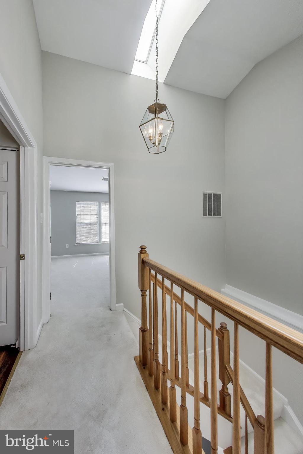 13504 Hayworth Drive Rockville, MD 20854 - Photo 11 of 31 a view of a hallway with windows