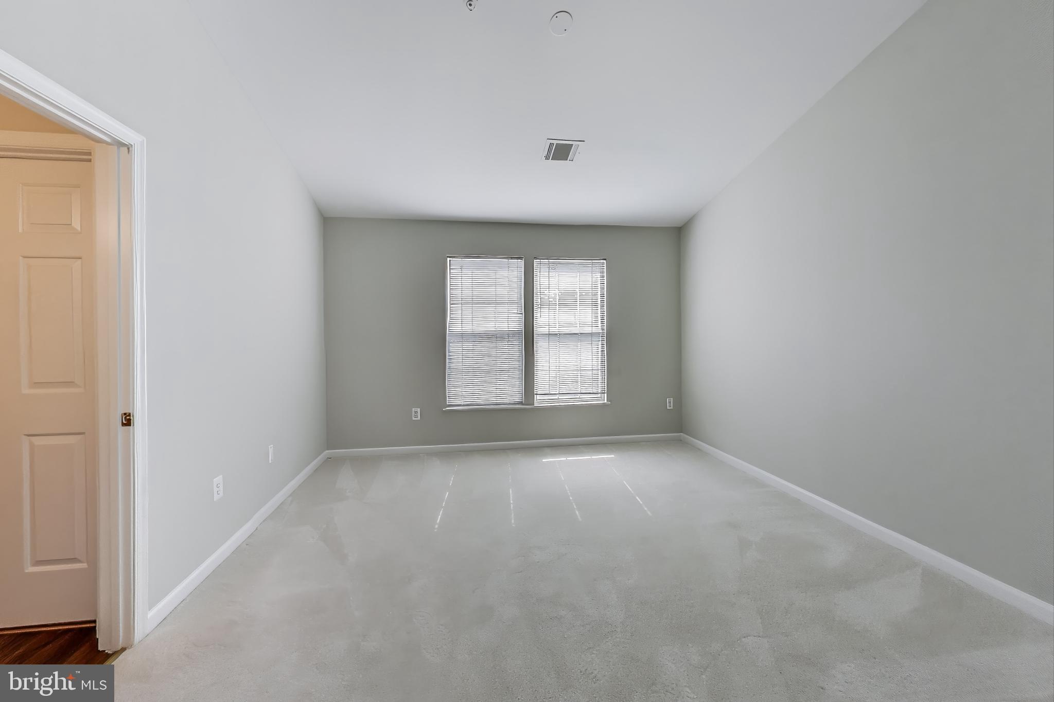 13504 Hayworth Drive Rockville, MD 20854 - Photo 12 of 31 an empty room with windows