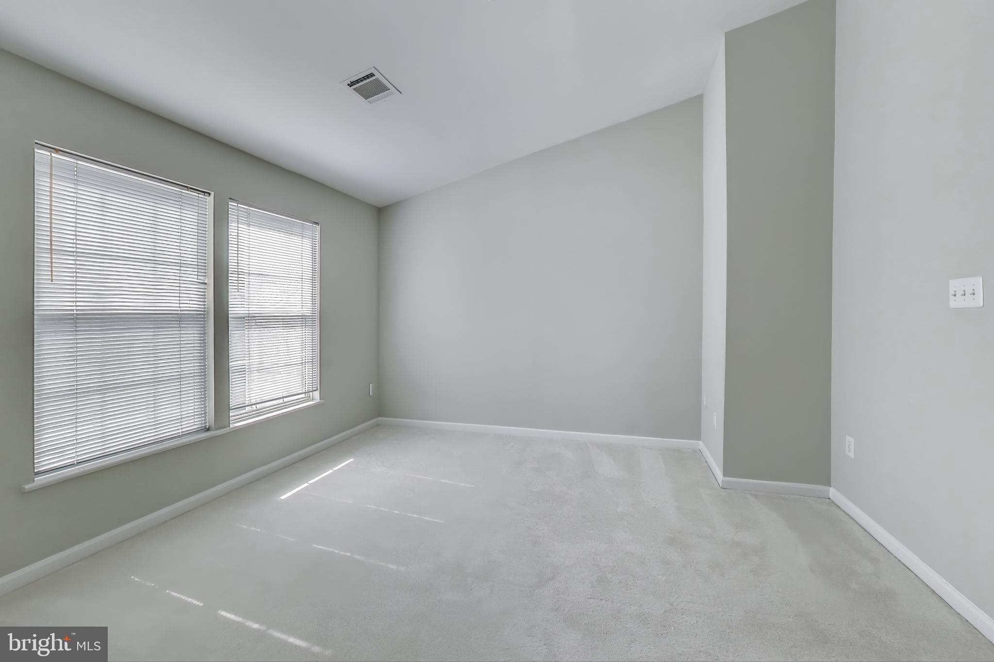 13504 Hayworth Drive Rockville, MD 20854 - Photo 13 of 31 a view of an empty room with a window