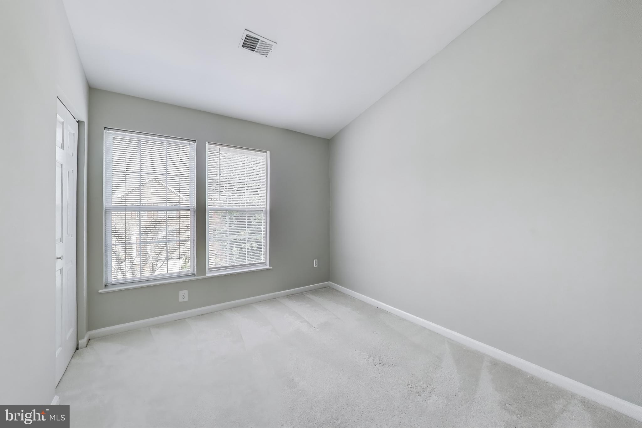 13504 Hayworth Drive Rockville, MD 20854 - Photo 18 of 31 a view of an empty room with a window