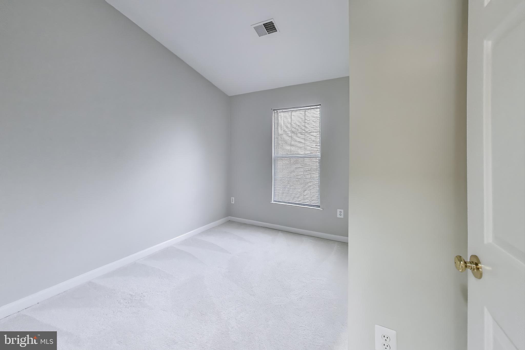 13504 Hayworth Drive Rockville, MD 20854 - Photo 20 of 31 a view of an empty room with a window