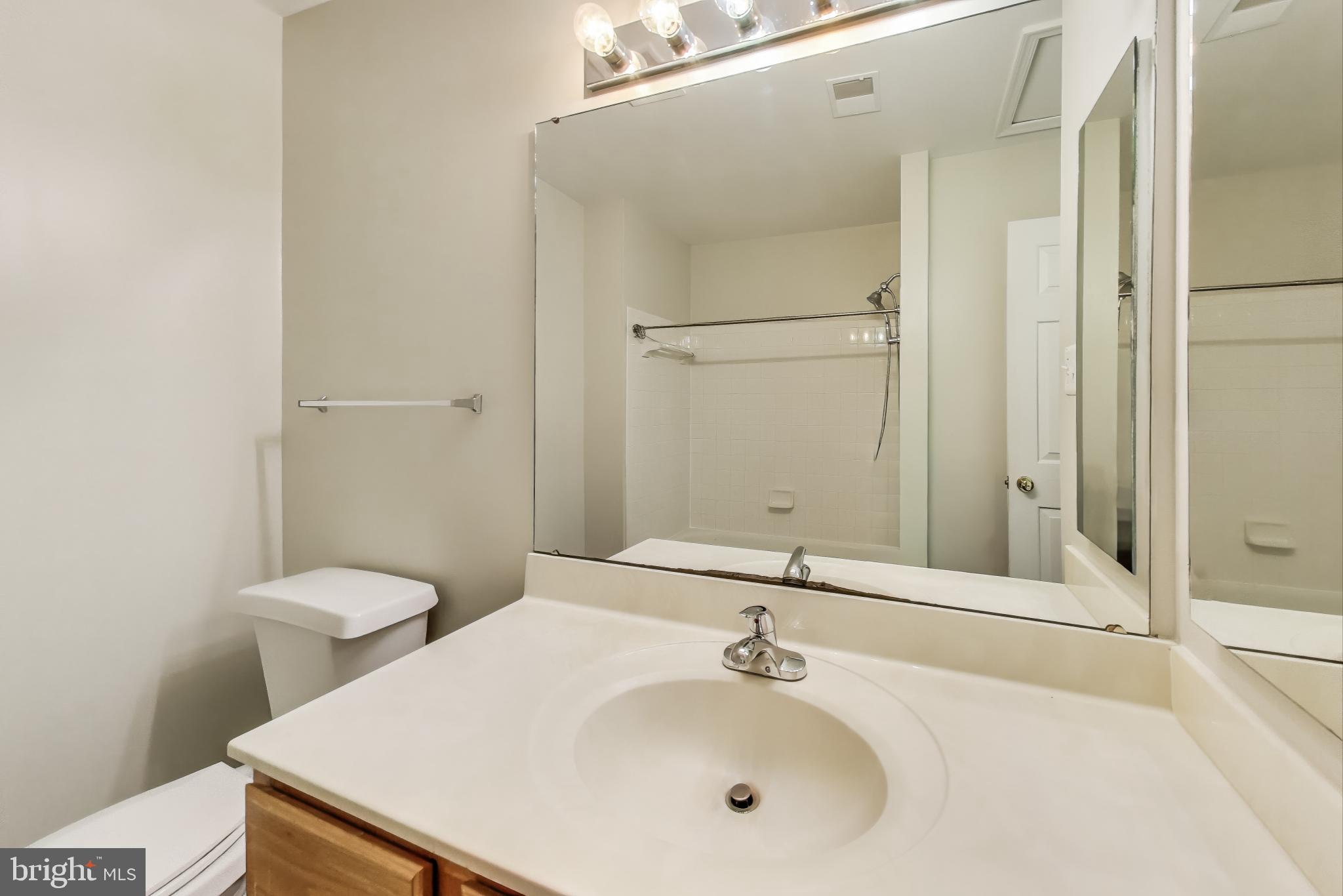 13504 Hayworth Drive Rockville, MD 20854 - Photo 22 of 31 a bathroom with a sink and a mirror