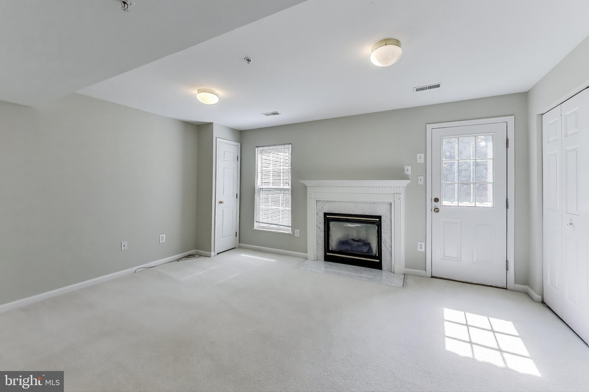 13504 Hayworth Drive Rockville, MD 20854 - Photo 23 of 31 a view of a livingroom with a fireplace and window