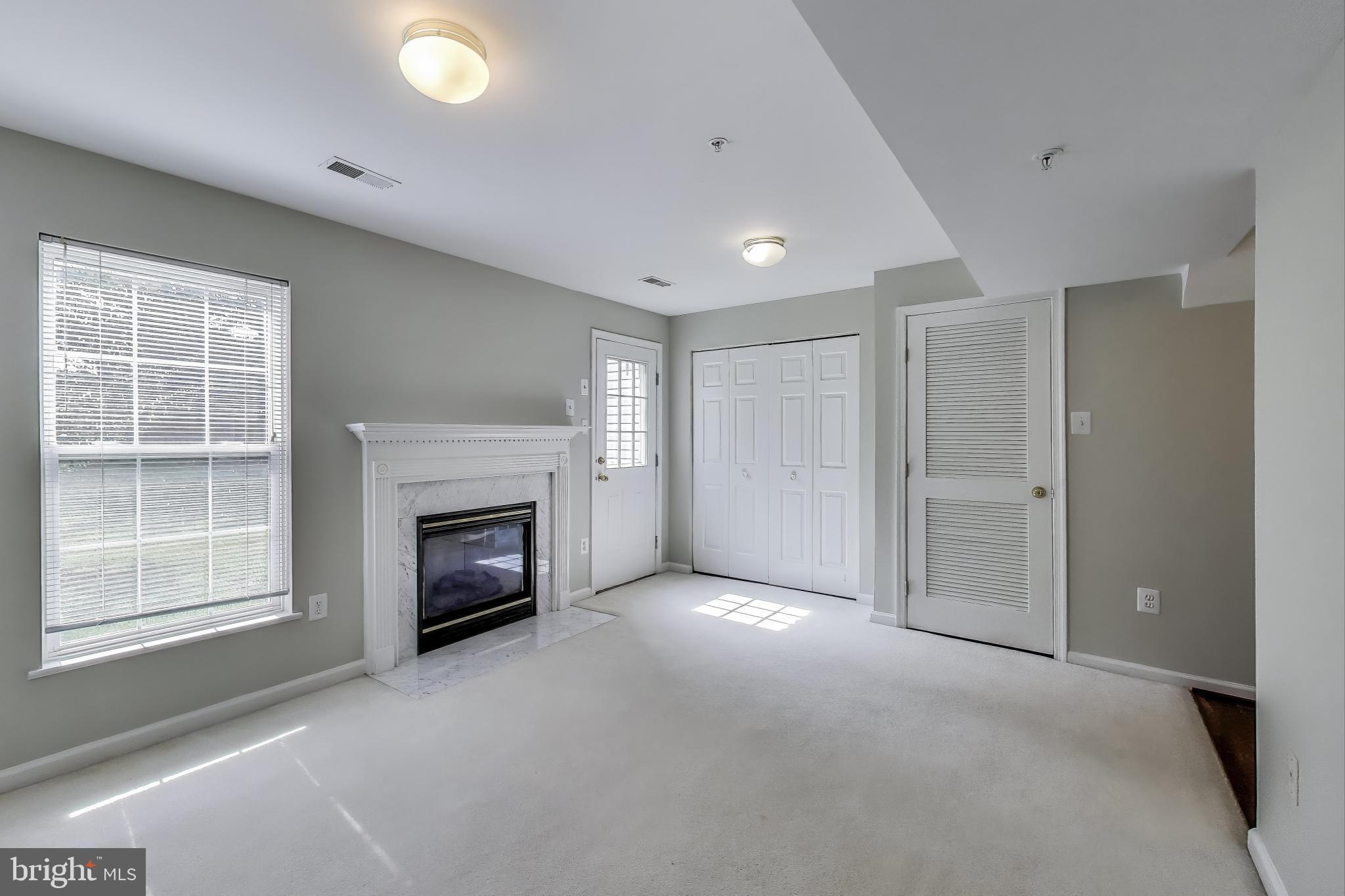 13504 Hayworth Drive Rockville, MD 20854 - Photo 24 of 31 a view of a livingroom with a fireplace and window