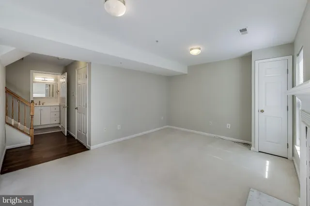 a bathroom with a toilet sink shower and mirror
