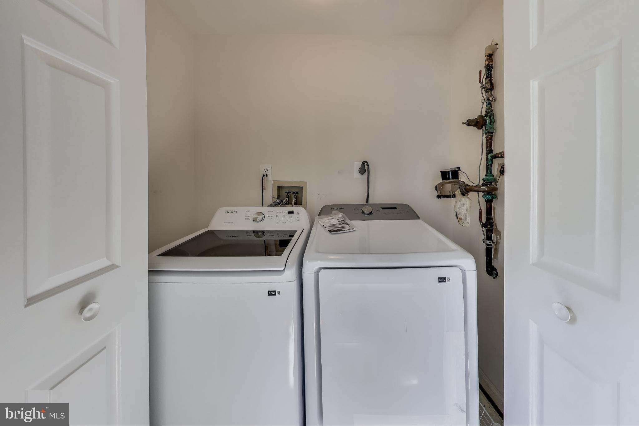 13504 Hayworth Drive Rockville, MD 20854 - Photo 27 of 31 a utility room with dryer and washer
