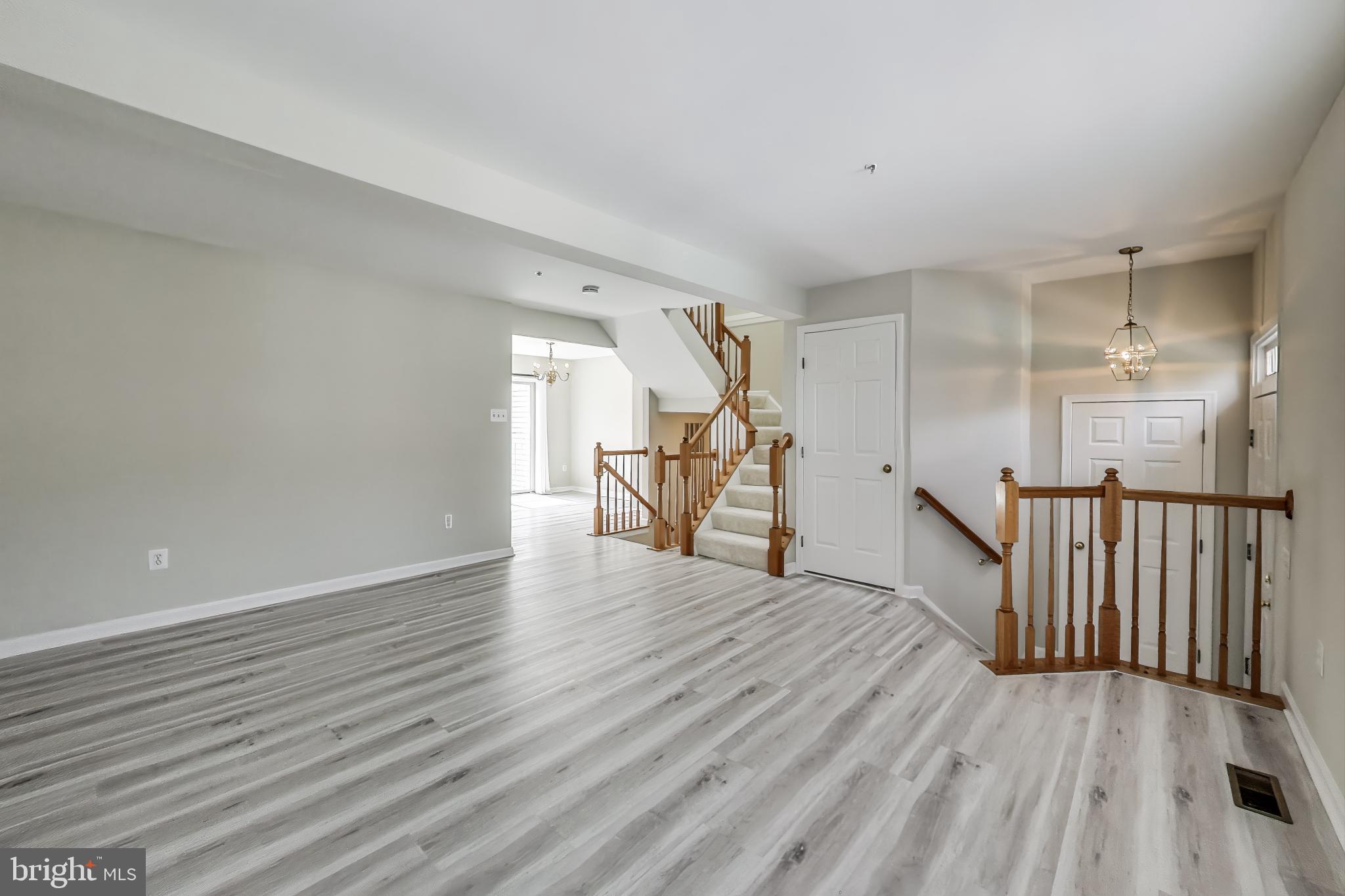13504 Hayworth Drive Rockville, MD 20854 - Photo 7 of 31 a view of an empty room with wooden floor