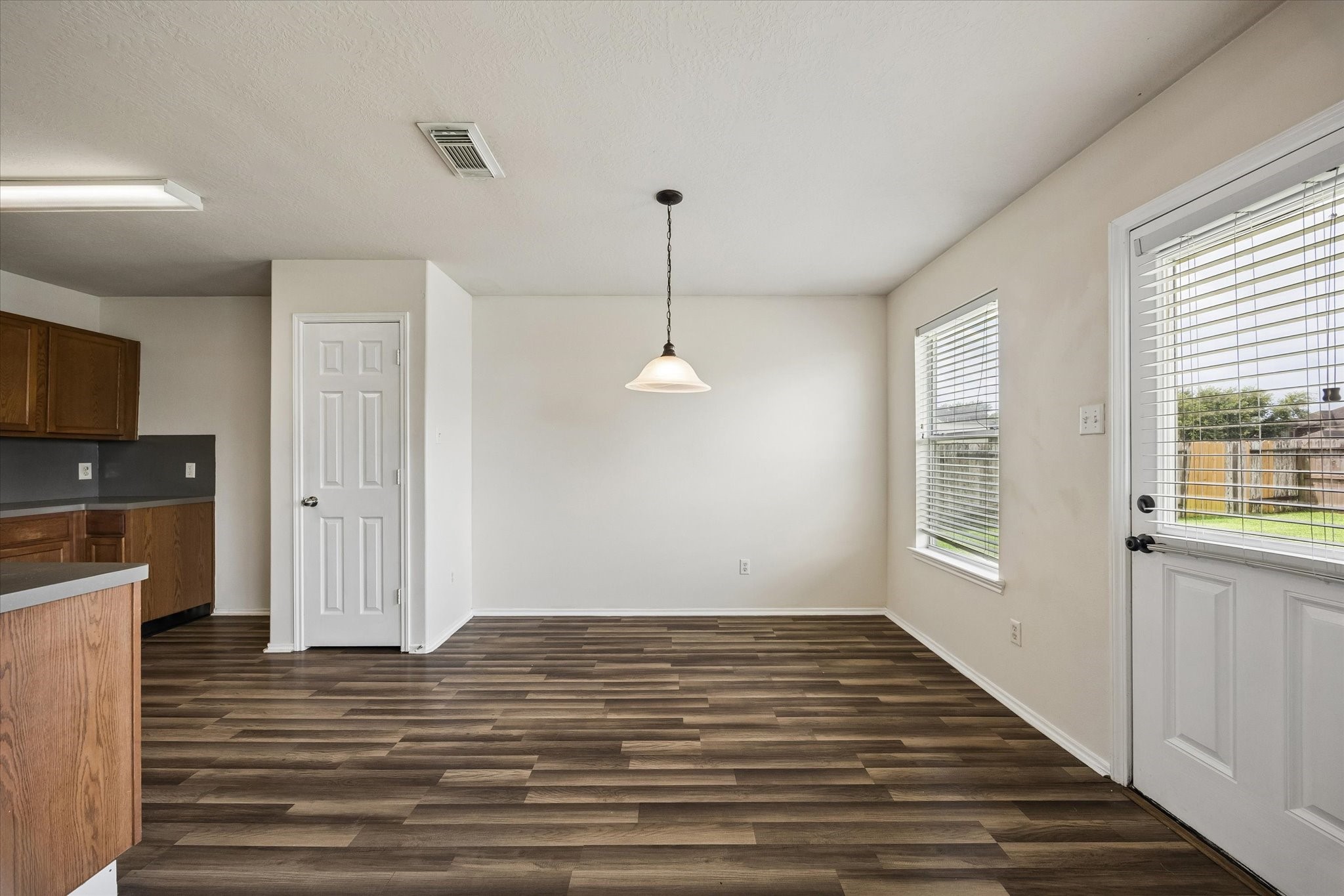 2614 Balsam Ridge Way Fresno, TX 77545 - Photo 5 of 14 a view of a room with wooden floor and windows