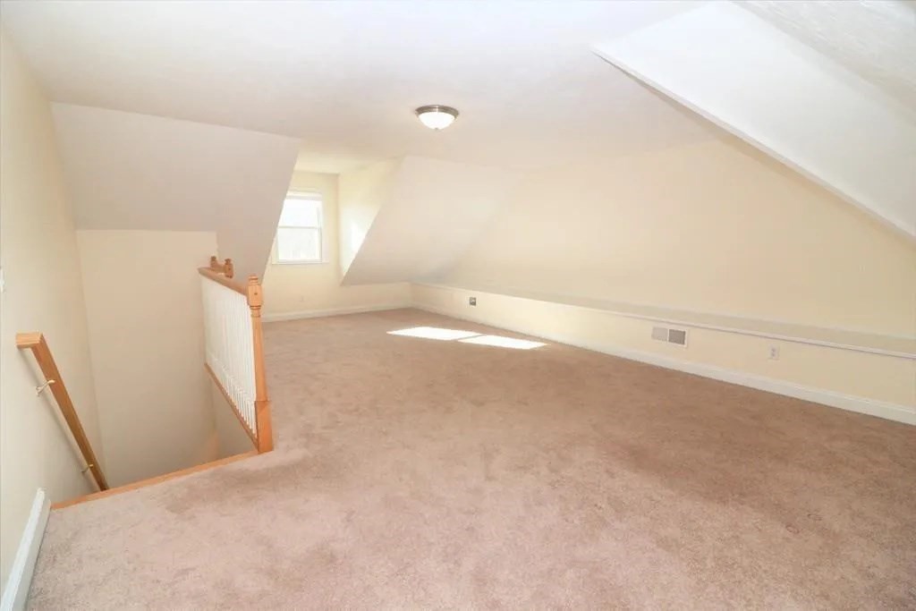 132 Howe Street, Unit B Natick, MA 01760 - Photo 18 of 32 a view of a big room with closet and windows
