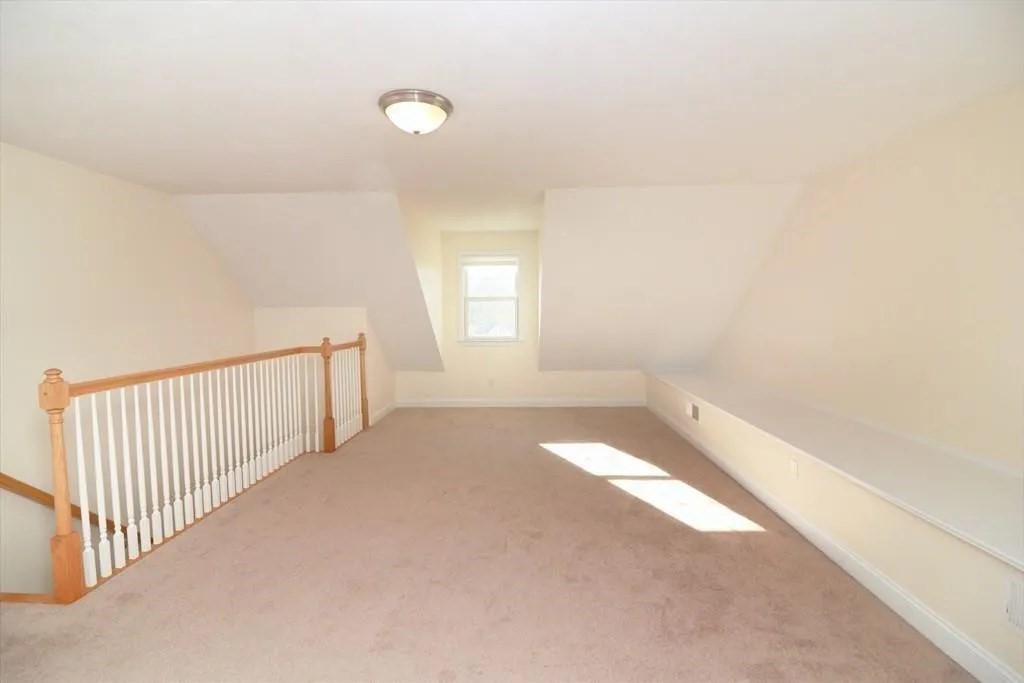 132 Howe Street, Unit B Natick, MA 01760 - Photo 20 of 32 a view of a livingroom with a staircase