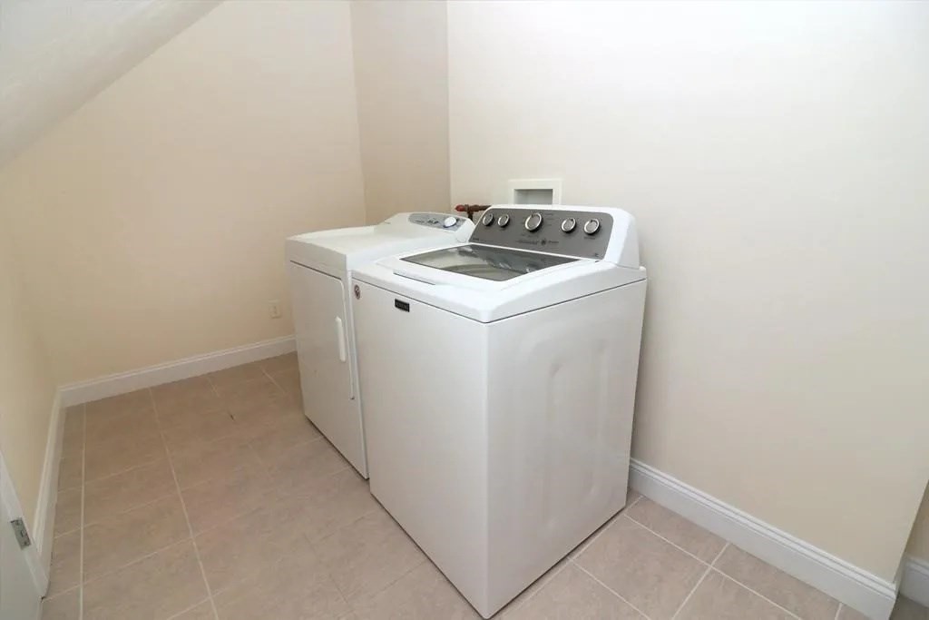 132 Howe Street, Unit B Natick, MA 01760 - Photo 2 of 32 a utility room with dryer and washer