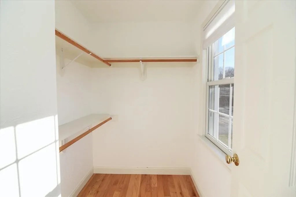 132 Howe Street, Unit B Natick, MA 01760 - Photo 29 of 32 a view of walk in closet with empty racks