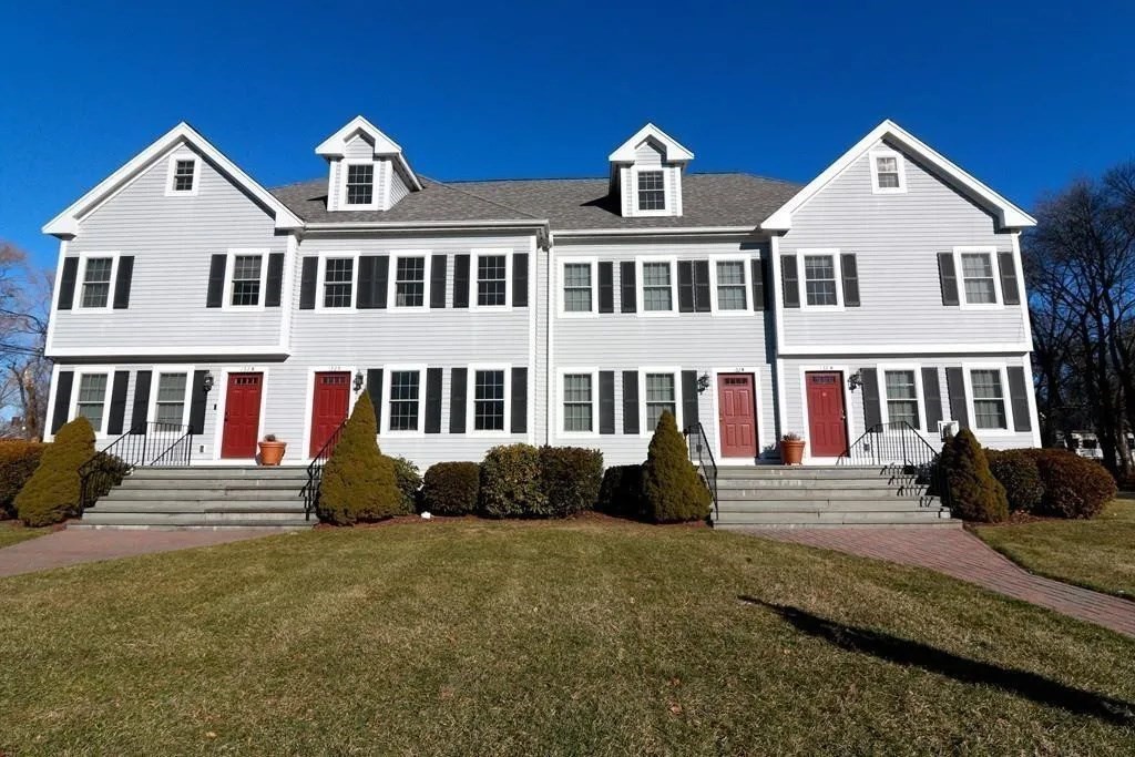 132 Howe Street, Unit B Natick, MA 01760 - Photo 8 of 32 a front view of a house with a yard