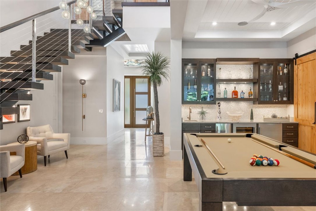 936 Surfsedge Way Vero Beach, FL 32963 - Photo 17 of 36 a room with lots of furniture and windows