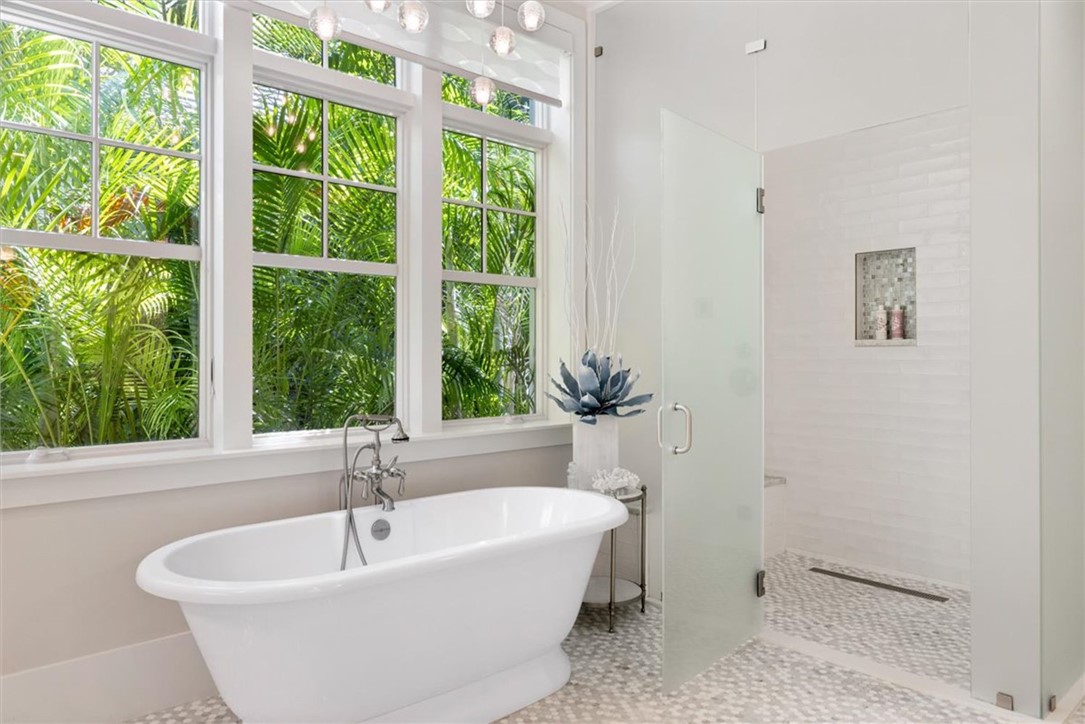 936 Surfsedge Way Vero Beach, FL 32963 - Photo 23 of 36 a white bath tub sitting in a bathroom next to a window