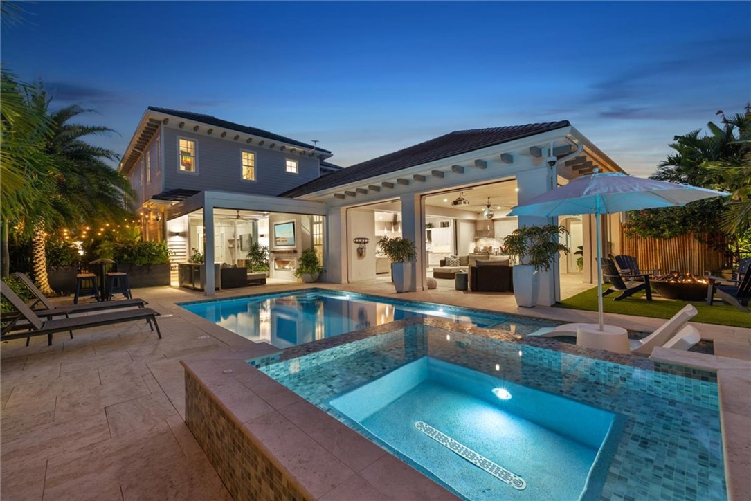 936 Surfsedge Way Vero Beach, FL 32963 - Photo 3 of 36 a view of a house with swimming pool and sitting area