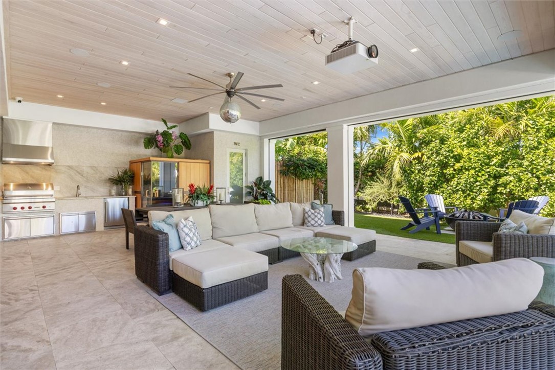 936 Surfsedge Way Vero Beach, FL 32963 - Photo 10 of 36 a living room with furniture and a large window