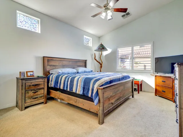 a bed room with a bed and a chandelier
