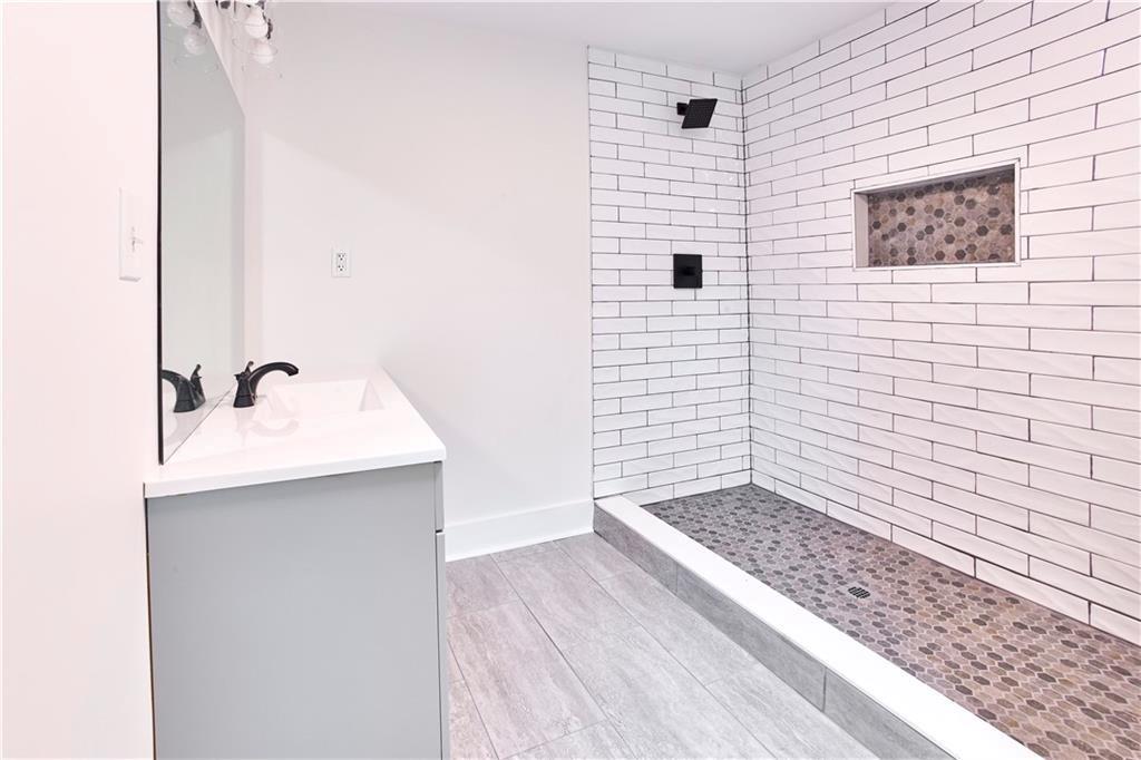 184 Scott Street Northwest Atlanta, GA 30314 - Photo 16 of 29 a bathroom with a sink and a mirror