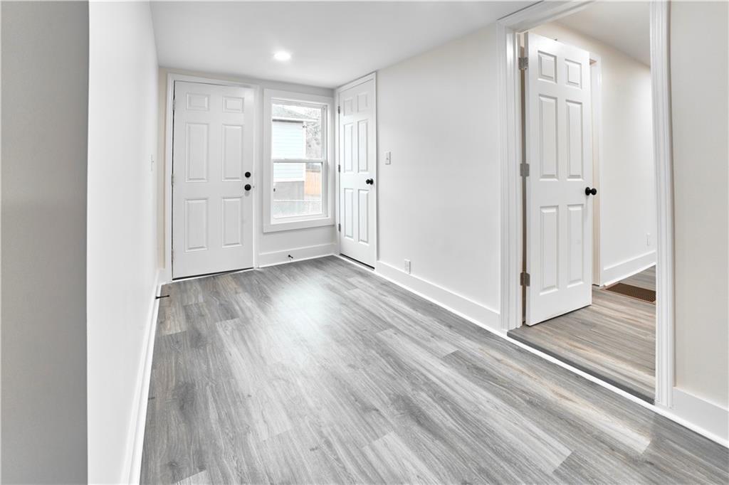 184 Scott Street Northwest Atlanta, GA 30314 - Photo 8 of 29 a view of a hallway with wooden floor