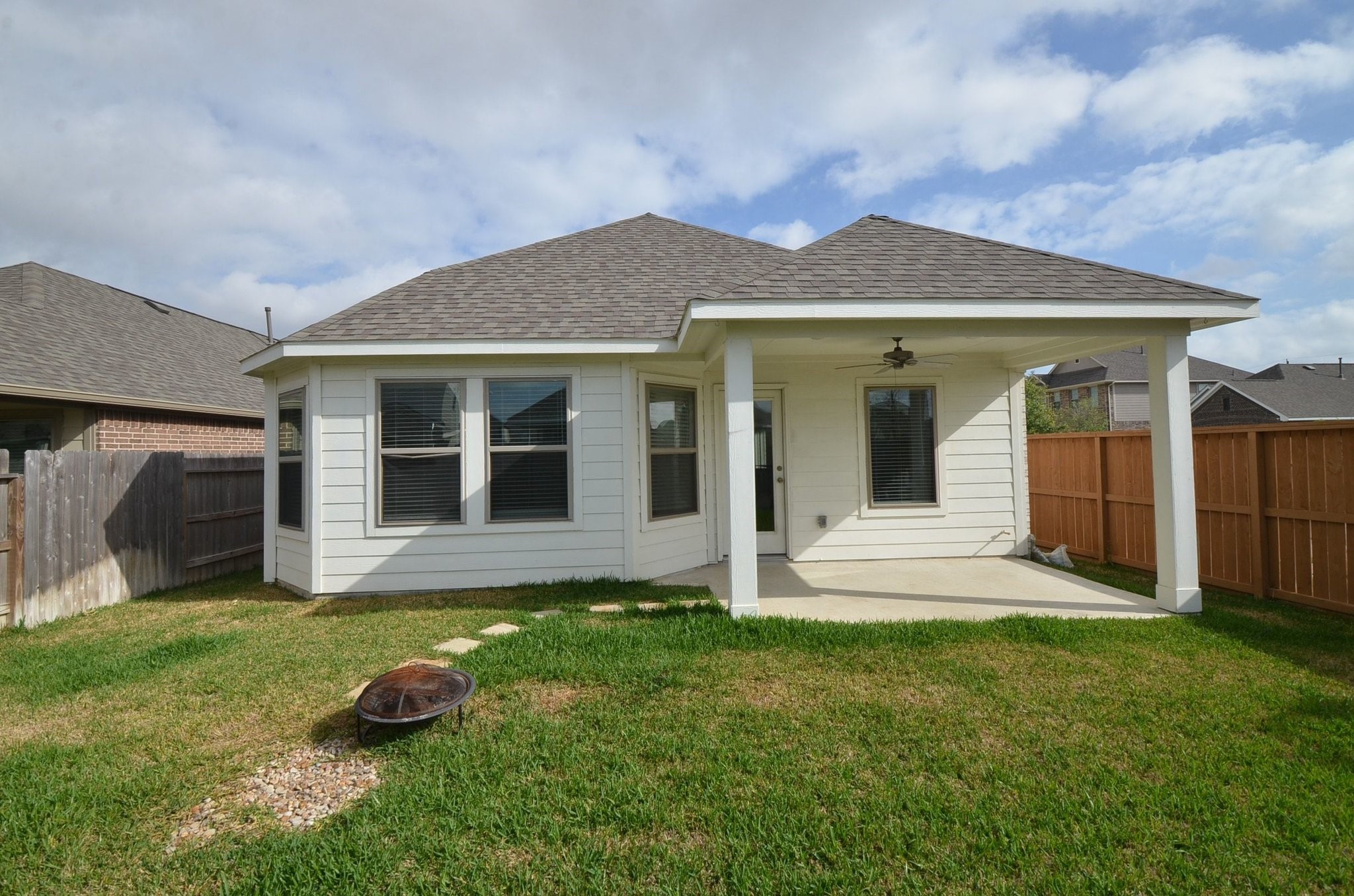 8230 Blue Fish Drive Cypress, TX 77433 - Photo 16 of 18 Covered back patio with a ceiling fan is perfect for entertaining!
