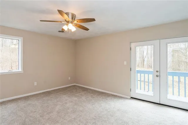 a view of a big room with closet and chandelier fan