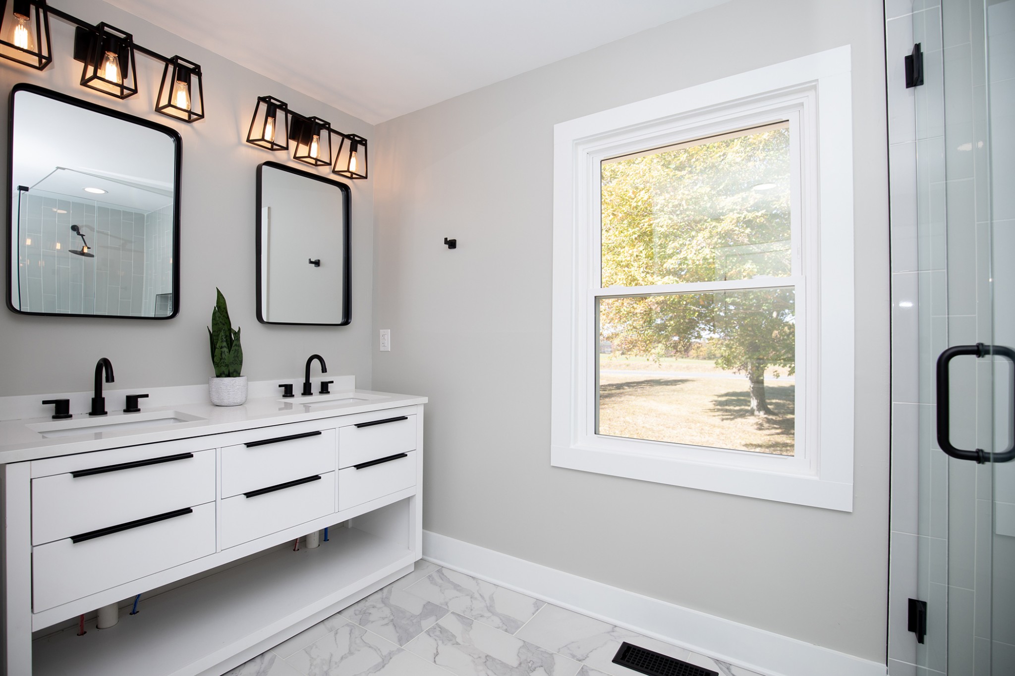 113 Old Parkers Chapel Road Portland, TN 37148 - Photo 13 of 27 a bathroom with a double vanity sink a mirror and a window