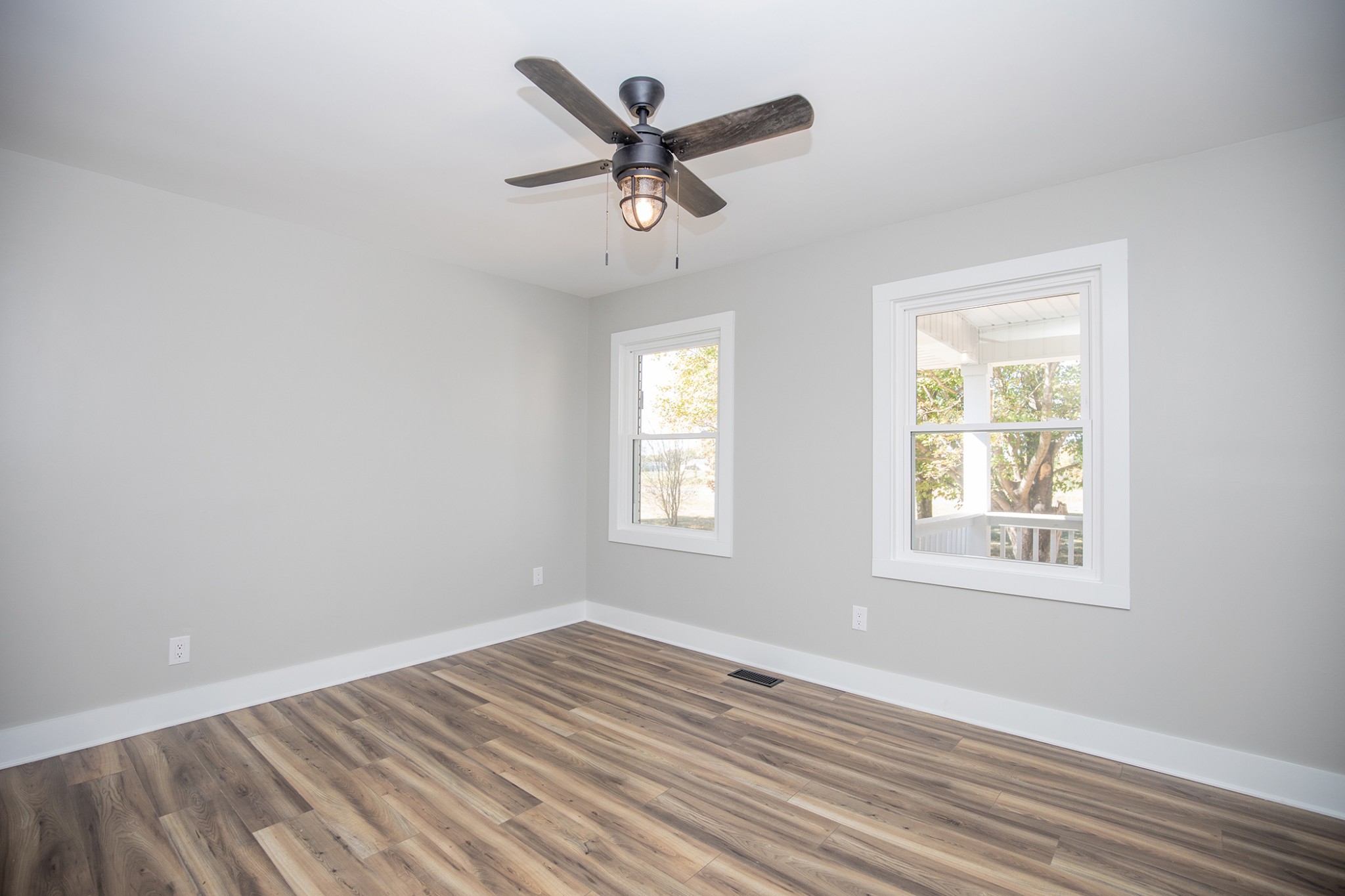 113 Old Parkers Chapel Road Portland, TN 37148 - Photo 14 of 27 a view of an empty room with wooden floor and a window