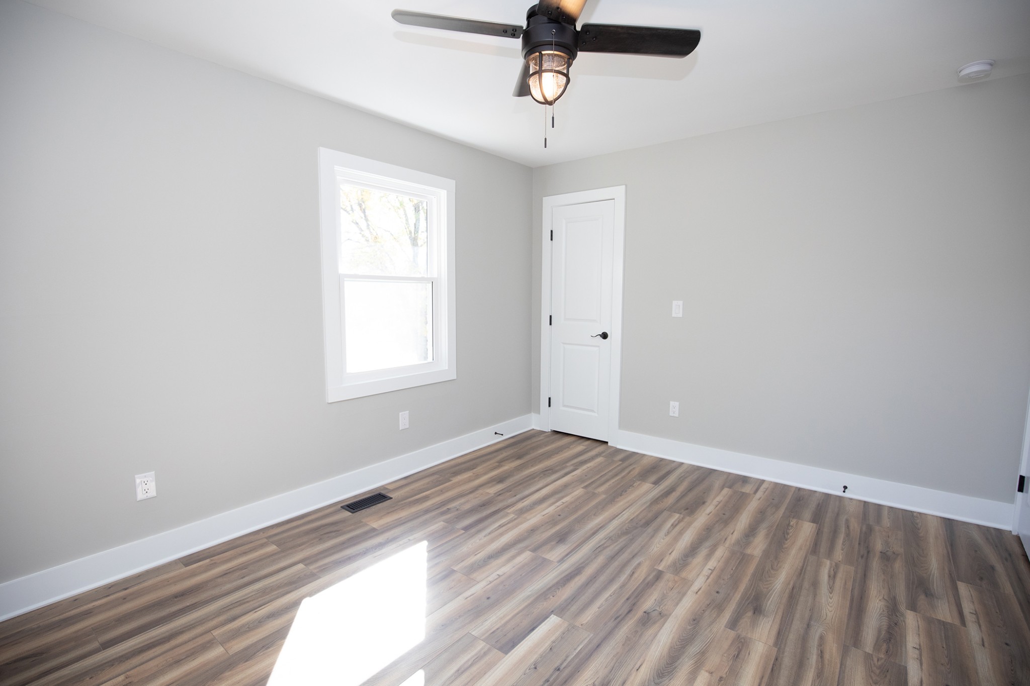 113 Old Parkers Chapel Road Portland, TN 37148 - Photo 15 of 27 wooden floor in an empty room with a window