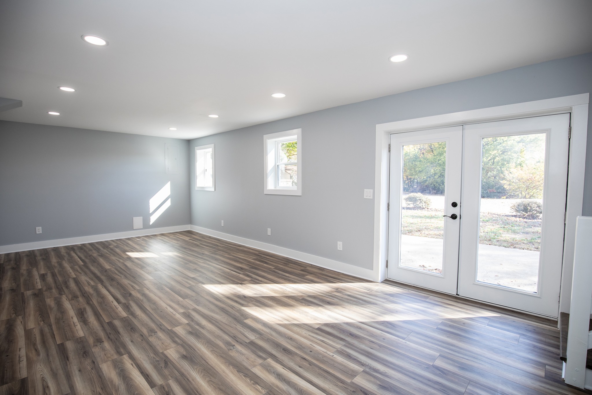113 Old Parkers Chapel Road Portland, TN 37148 - Photo 19 of 27 an empty room with wooden floor and windows