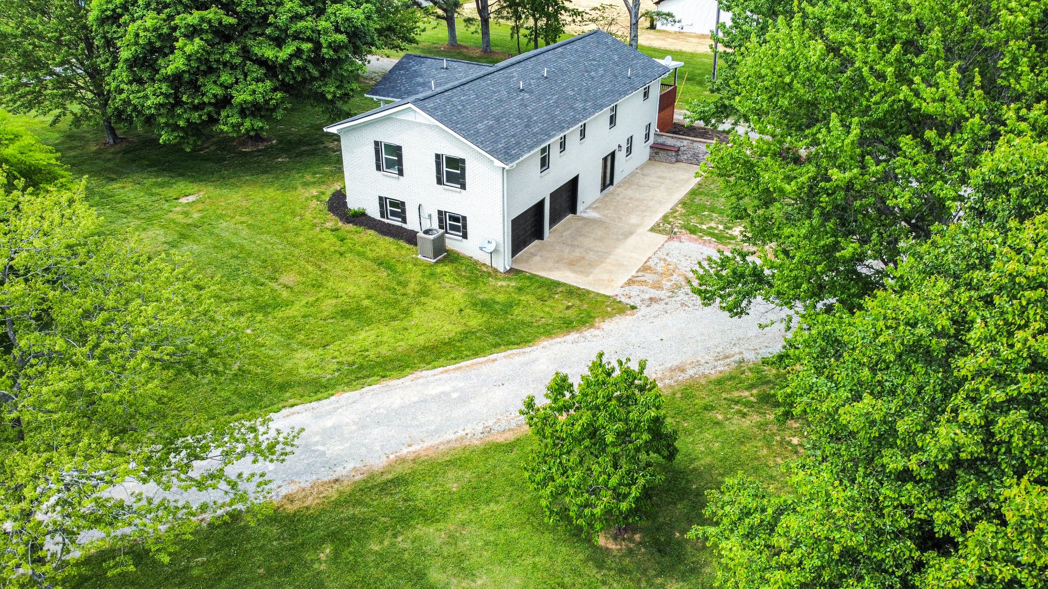 113 Old Parkers Chapel Road Portland, TN 37148 - Photo 25 of 27 a house with a tree in front of it