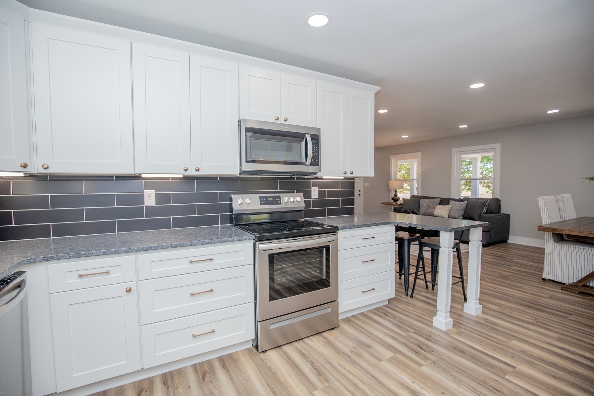 113 Old Parkers Chapel Road Portland, TN 37148 - Photo 5 of 27 a kitchen with stainless steel appliances granite countertop a stove a sink and a microwave