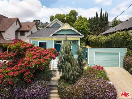 a front view of a house with yard