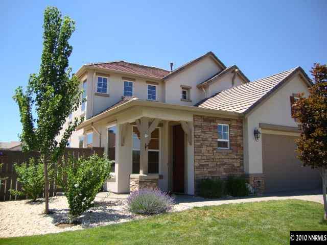 13765 Seabiscuit Drive Reno, NV 89521 - Photo 1 of 9 a front view of a house with a yard