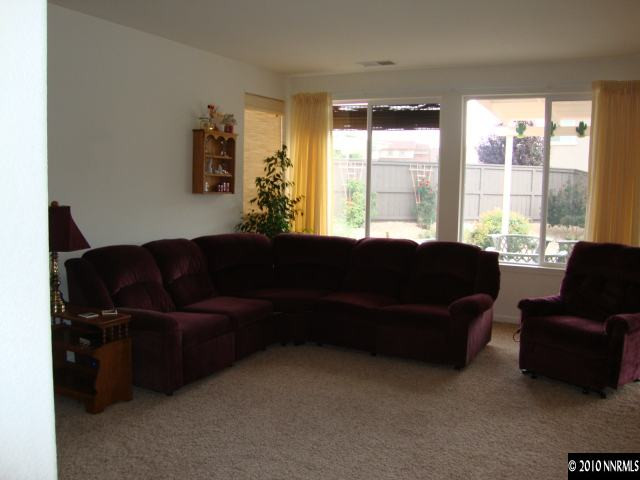 13765 Seabiscuit Drive Reno, NV 89521 - Photo 4 of 9 a living room with furniture and a large window