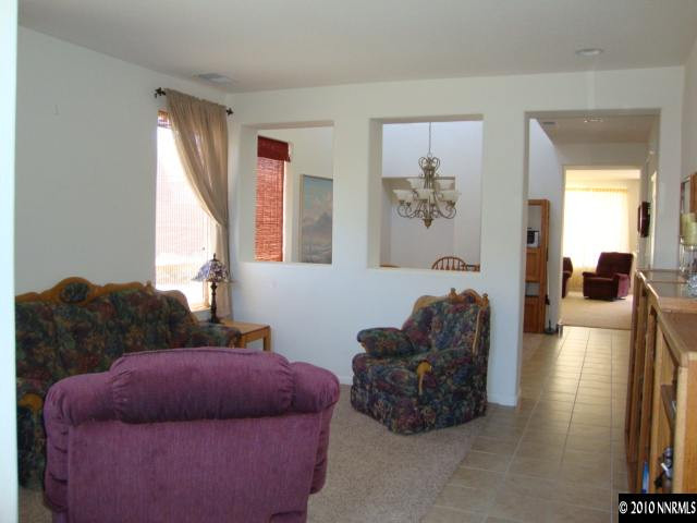 13765 Seabiscuit Drive Reno, NV 89521 - Photo 6 of 9 a living room with furniture and a large window