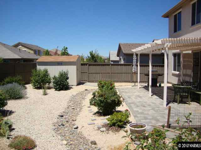13765 Seabiscuit Drive Reno, NV 89521 - Photo 8 of 9 a front view of a house with a yard