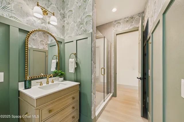 a living room with furniture and floor to ceiling windows