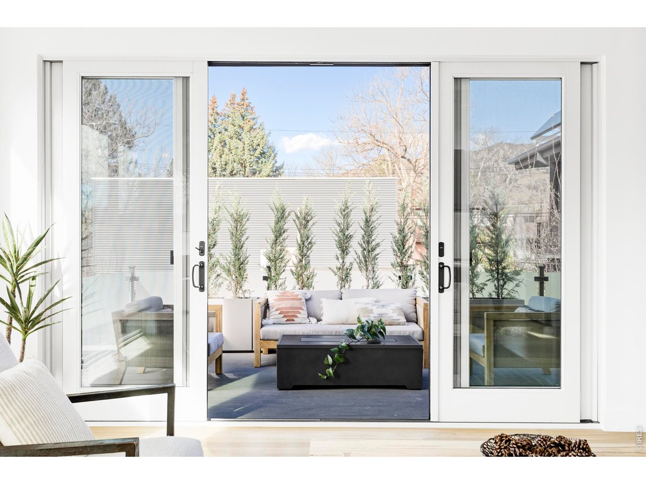 2895 18th Street Boulder, CO 80304 - Photo 13 of 29 Designed for year-round enjoyment, this outdoor retreat features a staircase to the backyard, and sweeping mountain vistas; perfect for hosting gatherings, savoring morning coffee, or unwinding under the stars.