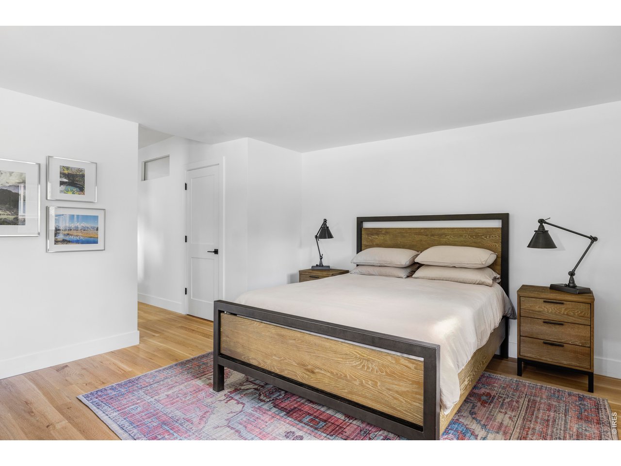 2895 18th Street Boulder, CO 80304 - Photo 18 of 29 The primary suite boasts a custom walk-in closet, while expansive windows frame serene views of the surrounding canopy.