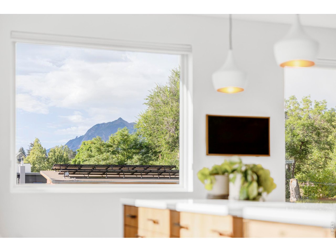 2895 18th Street Boulder, CO 80304 - Photo 4 of 29 From the kitchen window, enjoy unobstructed views of the Flatirons and Devil's Thumb.