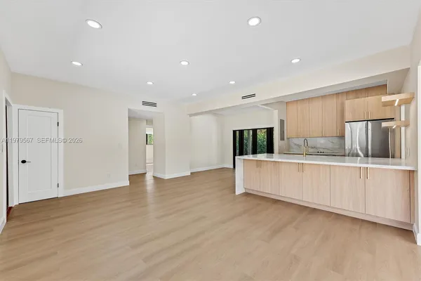 a view of kitchen with wooden floor