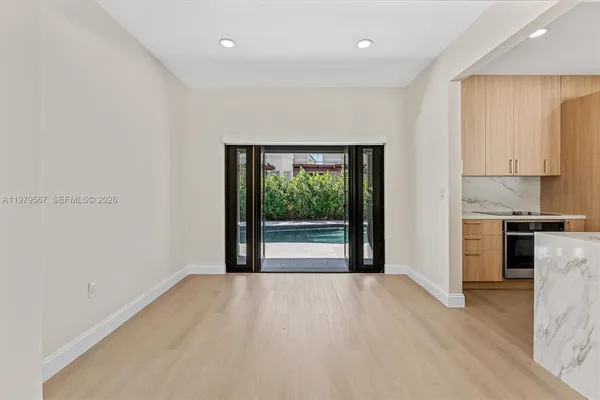 a view of a kitchen with a sink and a window